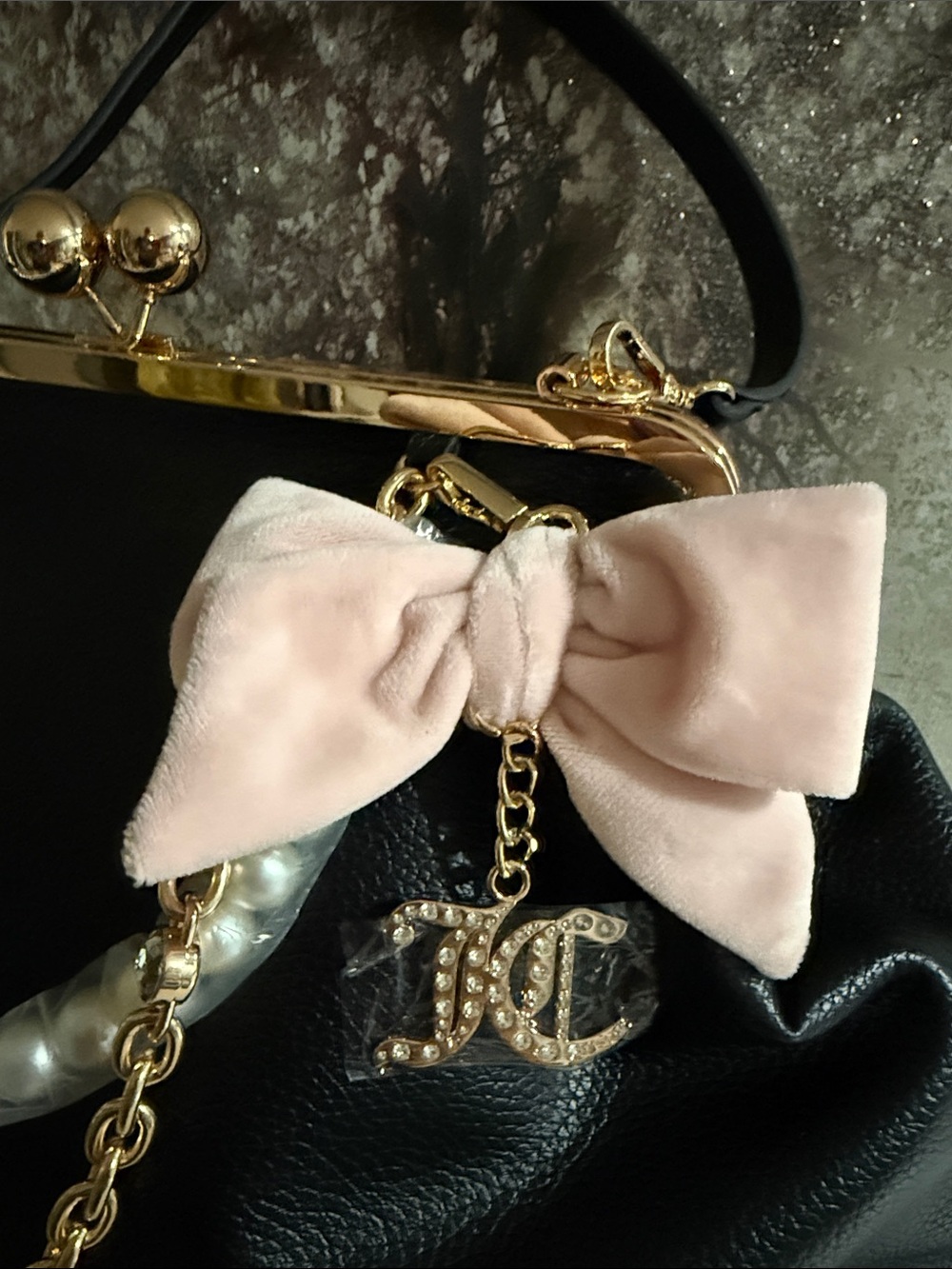 Juicy Couture kisslock handbag w/a prominent blush pink bow and pearl charm.$108 - Picture 3 of 10
